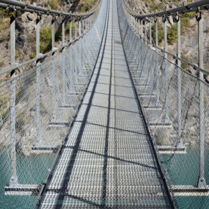 Horizontal view on himalayan footbridge crossing the Drac near Lake Monteynard, France